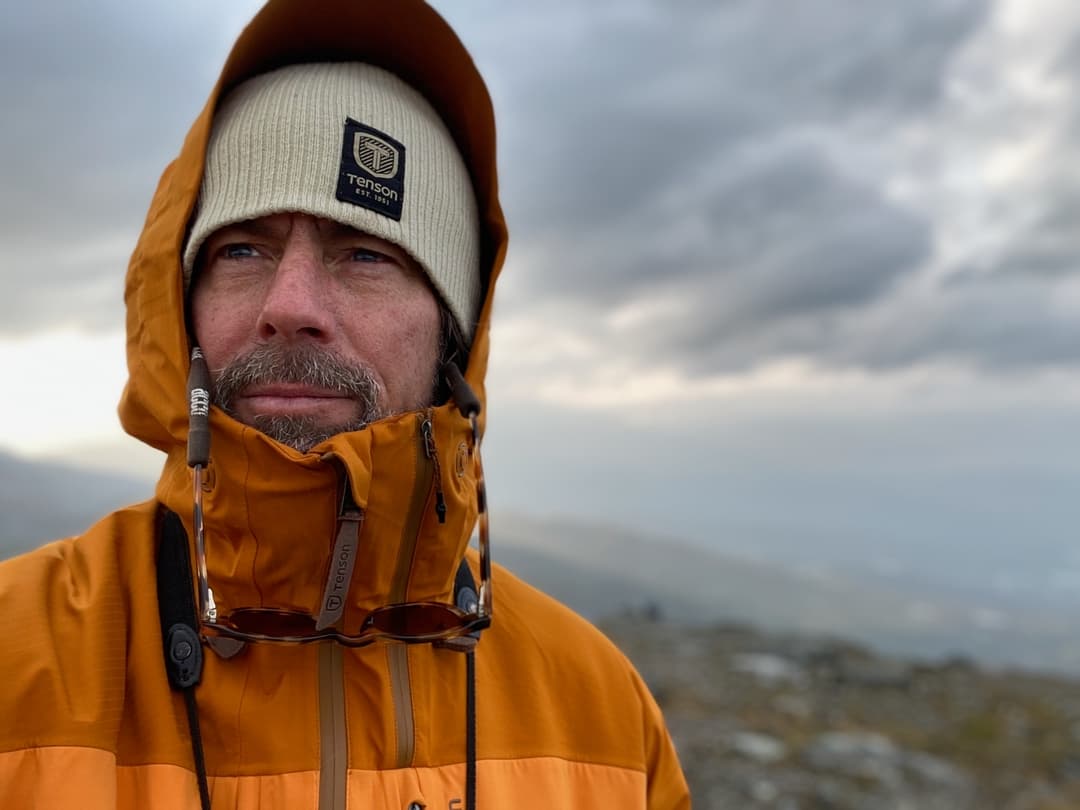 Chris Doyle standing centered in a landscape during fieldwork